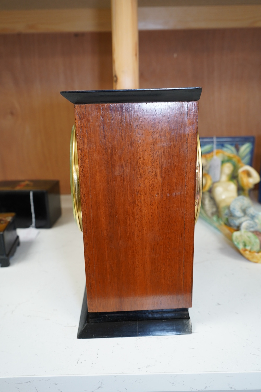 A George V mahogany and ebonised eight day movement mantel clock, 27cm high. Condition - good - No bell.